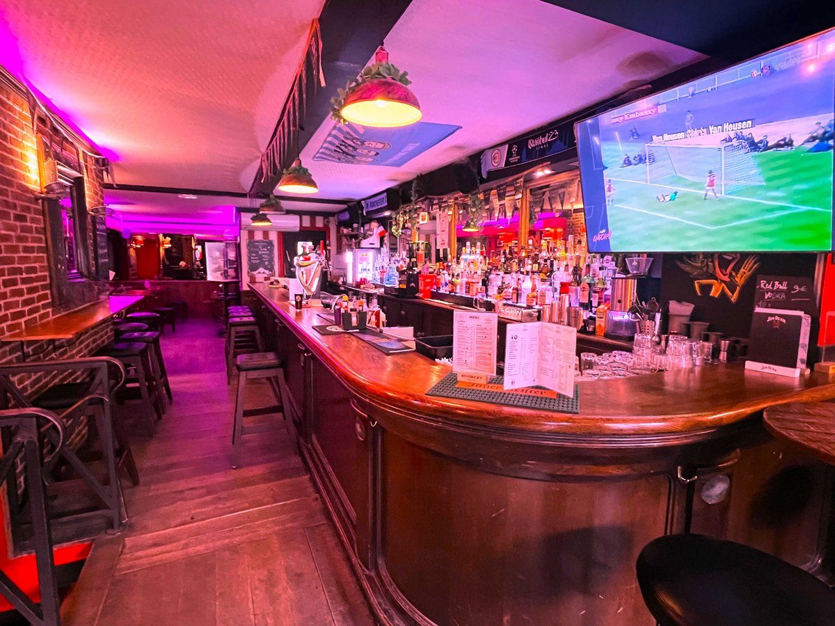 Football on the big screen above the bar