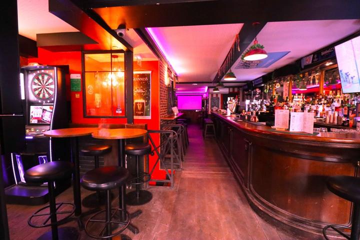 The darts corner next to the bar